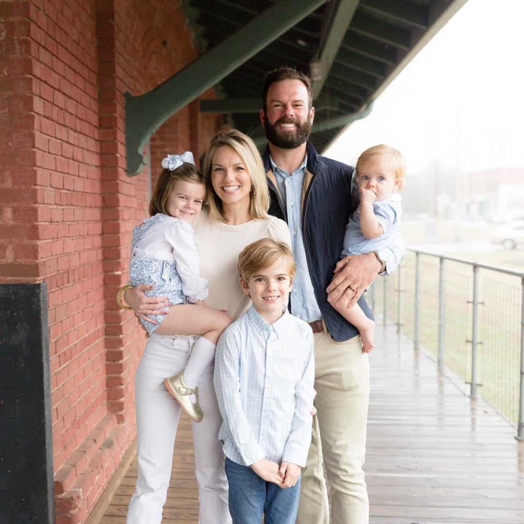 Family photo of owner, Douglas Mosteller, with his wife and three children.