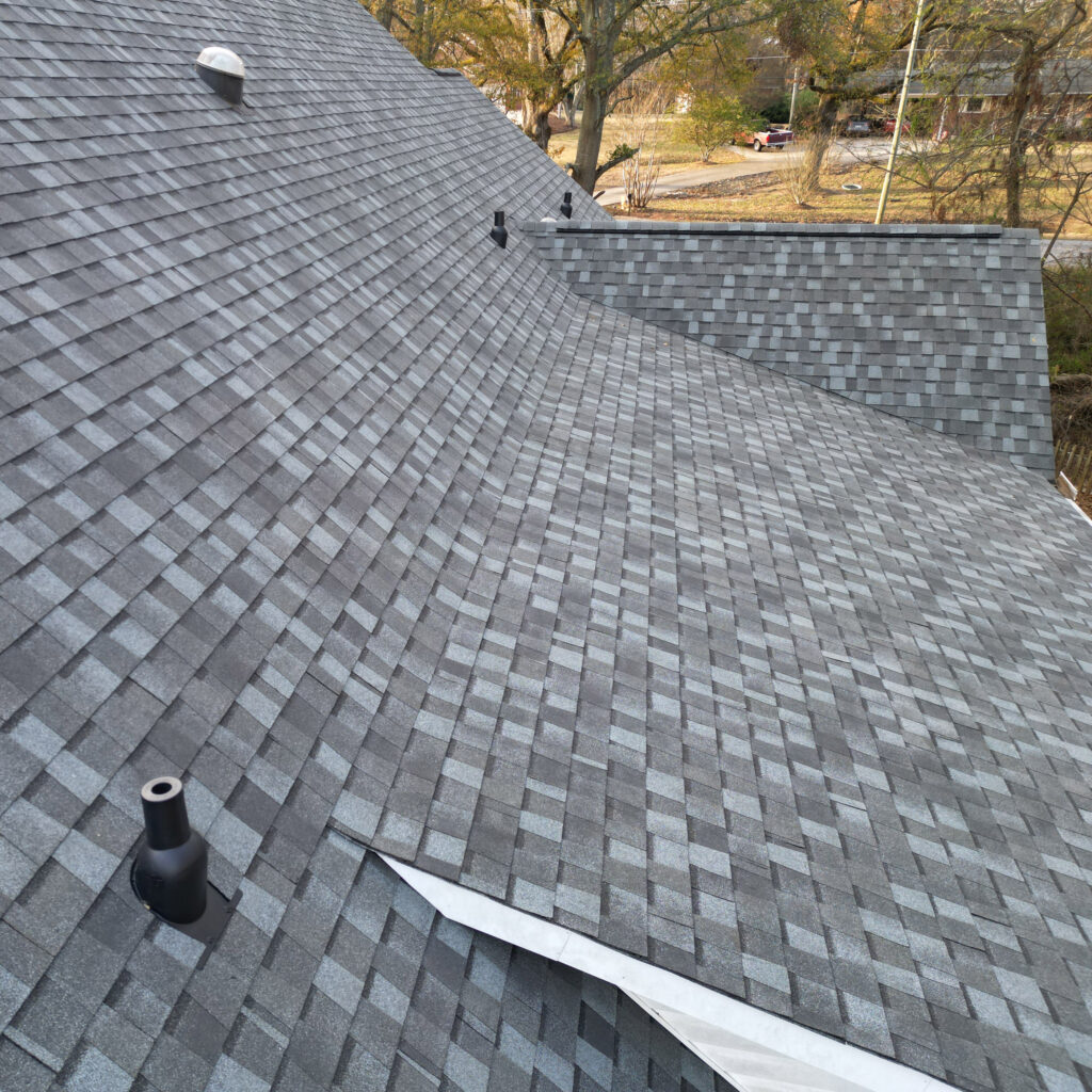 Close up shot of residential roof with asphalt shingles.