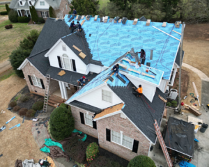 Aerial shot of Southern Shingles working on large residential roof.